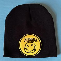 Come as you are in this cool Nirvana smiley face stocking hat!  Material: acrylic / stretchy Color: black, blue, burgundy  Size: one size fits most *All stocking hats are brand new/never worn/never washed FREE DOMESTIC SHIPPING ON ALL ITEMS! Stocking Hats, Nirvana Smiley Face, Stocking Hat, Smiley Faces, Skull Cap Beanie, Skull Cap, Smiley Face, Nirvana, Smiley