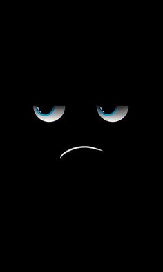 a black background with blue eyes and an angry expression on the face in the dark