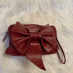 This Is A Brand New Cute Multiuse Bag In A Maroon Color. You Can Use It As A Crossbody Purse Or For Make Up And Cosmetic Needs Or You Can Use As An Evening Bag. It Has Shoulder Straps And A Wrist Strap New Without Tags Red Leather Bag With Zipper Pouch, Red Bags With Zipper Pouch, Red Crossbody Clutch With Adjustable Strap, Red Wallet With Detachable Strap For Everyday Use, Red Clutch With Adjustable Strap For Daily Use, Red Pouch Clutch With Adjustable Strap, Wristlet Purse, Big Bow, Big Bows