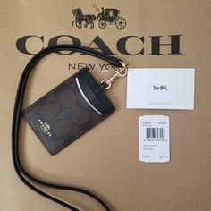 Coach Signature Brown Black Lanyard Id Card Badge Holder Case Wallet F63274 Not Excepting Offer On This Lanyard. Lowest Price On Pm.. Crafted In Our Signature Jacquard, This Lanyard Features An Id Window, Plus Two Card Slots At The Back. Wear It Around The Neck Or Detach The Strap And Tuck It Into A Bag. Signature Coated Canvas With Leather Details Two Credit Card Slots Id Window Dimensions: 2 3/4" (L) X 4" (H) Coach Lanyard, Window Dimensions, Black Lanyard, Id Lanyard, School Id, Bath Body Works Candles, Coach Accessories, Badge Holder, Id Holder