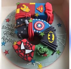 a birthday cake made to look like the avengerss and captain america symbols on top