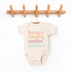 The perfect bodysuit for your perfect baby! These short sleeve bodysuits have 3 snap closure and double needle ribbed binding on neck, shoulders, sleeves, and leg openings. Machine wash cold, inside out. Air dry or tumble dry low. First Birthday Spring Cotton Bodysuit, Spring Cotton Bodysuit For First Birthday, Sweet Cotton Onesie For Playtime, Cute Cotton Onesie For Easter, Cute Short Sleeve Bodysuit For First Birthday, First Birthday Spring Onesie With Short Sleeves, Spring Playtime Letter Print Bodysuit, Playful Spring Onesie With Letter Print, Spring Playtime Onesie With Letter Print