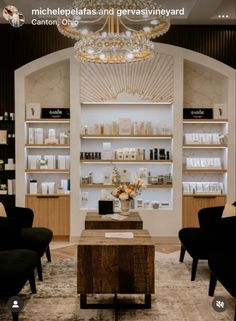 the inside of a store with chairs and shelves