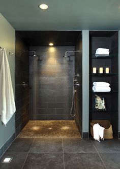 a walk in shower sitting inside of a bathroom