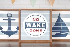 there are three signs that say no wake zone and one has an anchor on it