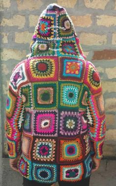 a person wearing a colorful crocheted jacket