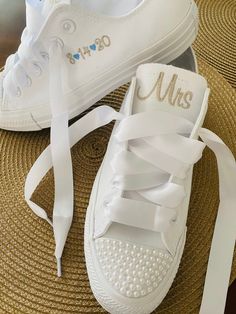 "Embroidered Converse Monochrome All WHITE Converse with pearl encrusted toe. PEARLS ARE ALL ONE SIZE! If you want multi sizes please state that or purchase from my other listing showing multiple size pearls. Font shown will be used unless you specify something different. Getting Married? What a great idea. This listing is for Mrs on one tongue and \"last name\" on other tongue with date on the side or no date up to you. Other options available in my shop!! Wear these at your reception so your f Converse Bride, Pearl Converse, All White Converse, Bride Converse, Bride Sneakers, Converse Wedding, Wedding Reception Outfit, Converse Wedding Shoes, Bling Converse