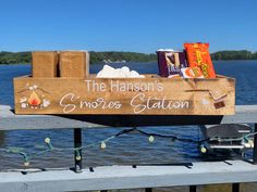 a wooden sign that says the hanson's smoker station with marshmallows on it