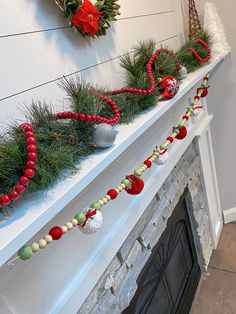 a mantle with christmas decorations on it