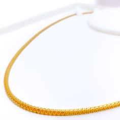 This chain is a fine example of craftsmanship, made from 22k yellow gold. It weighs 15.2 grams, indicating both luxury and durability. The length of the chain is 18 inches, perfect for a comfortable fit around the neck, with a width of 2.75 mm that provides a substantial yet refined appearance. It features a secure lobster lock, ensuring the chain remains safely in place. Ideal for those who appreciate the timeless elegance of gold, this piece combines classic appeal with robust design, making i 22k Yellow Gold Chain Necklace For Formal Occasions, 22k Gold Link Chain Necklace For Formal Occasions, Formal 22k Gold Link Chain Necklace, Formal 22k Yellow Gold Chain Necklace, 22k Yellow Gold Delicate Chain Necklace, Delicate 22k Yellow Gold Chain Necklace, 22k Yellow Gold Chain Necklace With Delicate Chain, 22k Gold Figaro Chain Necklace, Formal Yellow 22k Gold Chain Necklace