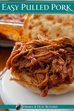 a pulled pork sandwich on a plate with pita bread in the background and text overlay that reads easy pulled pork sandwiches