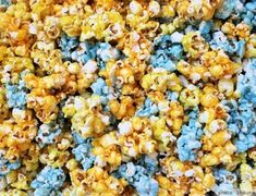 blue and yellow popcorn kernels are mixed together