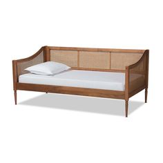 a bed with a wooden frame and white sheets