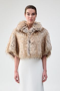 Dress the party: receive 20% off when purchasing four or more bridal styles. Use code BRIDAL20 at checkout. Luxurious and chic, the gorgeous Nord Cape is made from the most premium faux fur and features a wide collar with a concealed hook & eye closure in the front. Perfect for a black-tie event or regular wear, this cozy cape is the perfect layering piece. This garment is a one-size-fits-all. Bridal Styles, Black Faux Fur Coat, Evening Jackets, Fur Fabrics, Black Tie Event, Black Faux Fur, Hook Eye, Faux Fur Coat, Ethical Fashion