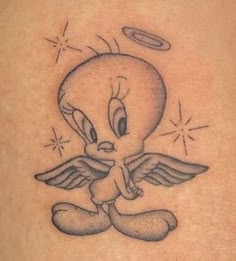 a cartoon character tattoo on the back of a woman's shoulder, with an angel