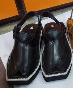 Hand Stitched high quality leather Kaptan Peshawari chappal made from the finest leather and Materials to provide wearer the best comfort. Experienced craftsman to deliver you not only the product a finest state of the art Chappal to give your personality an Elegant look. Material: Leather Sole: Highest quality tire rubber Product Colors: Yellow (Golden) , Black, brown, Dark Brown, Geans Color, gray Polish: Yes washable and ploish Size: 7 to 12 Shape: Shape through hand stitching without using k Traditional Closed Toe Sandals With Leather Lining, Leather Sandals With Dabka And Round Toe, Traditional Leather Open Toe Shoes, Pakistan Photos, Gray Polish, Tail Dress, Imran Khan, A Perfect Day, Blue Sandals