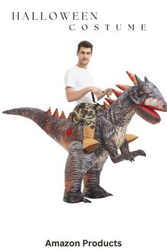 a man riding on the back of an inflatable dinosaur with horns and claws