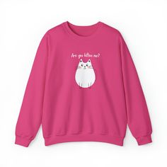 Nothing says "purr-fect" better than the Kitten Me Crewneck Sweatshirt! Featuring a plump white cartoon cat, this adorable piece of apparel will make anyone who sees it "meow-worthy". With its catchy phrase, "Are you kitten me?", this sweatshirt is sure to leave an impression wherever you wear it.Available in a variety of colors, this crewneck is perfect for any self-professed cat-lover out there. Ideal for everyday wear or special occasions like a family reunion or friend gathering, the Kitten Cute Cotton Sweatshirt With Cat Design, Cute Crew Neck Sweatshirt With Cat Design, Cotton Crew Neck Sweatshirt With Cat Design, Trendy Crew Neck Sweatshirt With Cat Design, Trendy Cotton Sweatshirt With Cat Print, Pink Long Sleeve Tops With Cat Design, Pink Long Sleeve Top With Cat Design, Funny Cotton Tops With Cat Design, Cat Themed Clothes