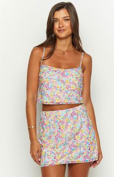 Milliana Painted Floral Pink Mini Skirt

How to style:
Our pretty floral mini skirt () is the perfect addition to your summer wardrobe! Style it with the matching crop top () and a pair of white strappy heels () to create a fun look for a cocktail party.

Features:
  
 * Light weight material 
 * Non-stretch material 
 * Lined 
 * Mini length 
 * Pull on style 
 * Bias Cut  
 * Exclusive print White Strappy Heels, Prom Midi Dress, 60's Dress, Pink Mini Skirt, Summer Playsuit, Semi Formal Dresses, Floral Mini Skirt, Strapless Tops, Crop Top Sweater