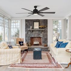 a living room filled with furniture and a fire place