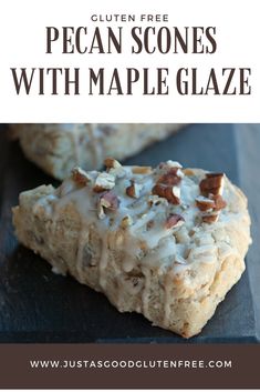 two pieces of pecan scones with maple glaze are on a black plate