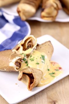 some food is on a white plate with blue and white napkins