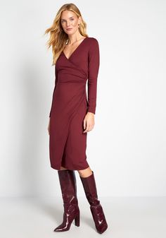 This burgundy, ModCloth label midi dress gives new life to a classic wrap silhouette with its long sleeves, surplice neckline, and ruched detailing—a subtle but chic detail that makes a surefire statement. 95% Rayon, 5% Spandex. Hand wash. Unlined. Semi-sheer. Made in the United States Model is wearing size: 1X S Fabric provides stretch. S=41 inches Length 1X=42.5 inches Length | ModCloth Knit on the Town Faux-Wrap Dress in Red, Size Medium Vintage Style Swimwear, Casual Dresses Plus Size, Midi Dress Plus Size, Vintage Swimwear, Surplice Neckline, Womens Vintage Dresses, Midi Dress Casual, Plus Size Sweaters, Fit N Flare Dress