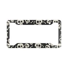 a black and white license plate with skulls on it