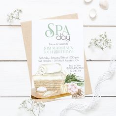 a spa day birthday party card with flowers and soap on the table next to it