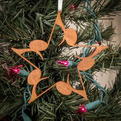 a wooden ornament hanging from a christmas tree