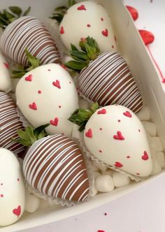 chocolate covered strawberries are arranged in a box