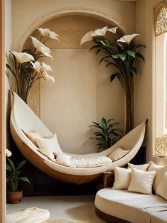 a living room filled with lots of furniture and flowers in the window sills