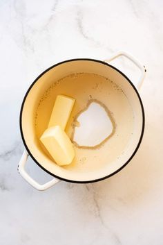 two cubes of butter are in a pot