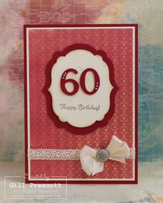 a close up of a birthday card with a bow on the front and number 60 on the back