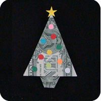 an origami christmas tree made out of one dollar bill with lights on top