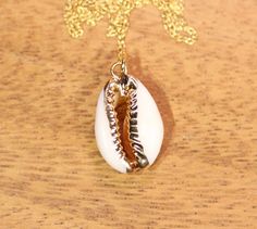 Cowrie shell necklace - summer necklace - gold cowrie shell - beach necklace - bff necklace - sea shell necklace A perfectly one of a kind gold lined cowrie shell hanging happily from a 14k gold vermeil chain at the length of your choice! Because of nature and all its beauty, the shell you receive may have a slight variation in shape. the shell measures aprox 20mm from top to bottom :) ♥ Handmade with love in sunny California ♥ This gem will arrive happily in a gift pouch or box Want to see more Shell Hanging, Sea Shell Necklace, Bff Necklace, Cowrie Shell Necklace, Beach Necklace, Bff Necklaces, Beach Necklaces, Sunny California, Shell Beach