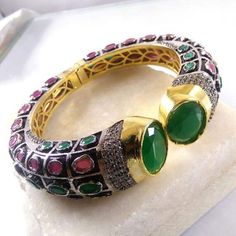 This Listing is for 1 Piece Beautiful Red Aventurine,Green Onyx & CZ Hydro Gemstone Gold Plated Cuff Bangle Bracelet Jewelry Gemstone: Red Aventurine,Green Onyx & CZ Metal : Brass  Style : Cuff Bracelet  Size : Cuff Adjustable Size Plating :  Gold Plated & Black Oxidize  Color : Green,Yellow,White,Red Note : We Ship Parcel Via India Post Economy Shipping It's Take 20 To 25 Days To Arrive. Check my other items frequently. I will be adding to the inventory regularly. Be sure to visit my shop to ch Jeweled Ruby Round Bracelets, Green Bracelet With Stone Setting As Gift, Handmade Ruby Bangle Bracelet, Red Gemstone Bangle Cuff Bracelet, Red Gemstone Cuff Bracelet, Ruby Jeweled Bangle Bracelets, Jeweled Bangle Cuff Bracelet As Gift, Jeweled Cuff Bangle Bracelet For Gift, Ruby Jeweled Bracelets As Gift