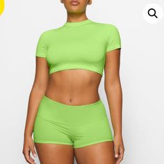 Nwt Skims Cover Up Fold Over Lime Shorts Worn By Hailey Beber K5 Short Solid Color Swimwear For Spring, Summer Cropped Fitted Bottoms, Fitted Cropped Summer Bottoms, Sporty Cropped Bottoms For Summer, Spring Swimwear Short Length, Green Short Tops For Beach Season, Fitted Cropped Beachwear Bottoms, Short Green Tops For Beach Season, Stretch Cropped Bottoms For Summer