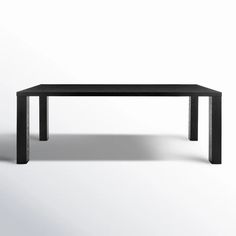 a black table sitting on top of a white floor