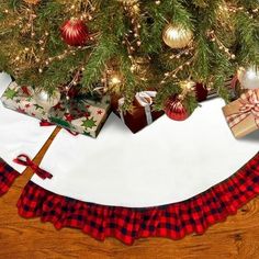 a christmas tree skirt with presents under it