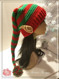 a knitted elf hat on top of a mannequin head