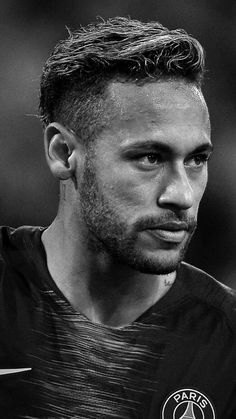 a black and white photo of a soccer player