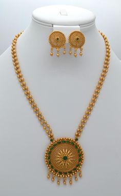 Introducing the beautiful traditional antique gold pendant, the Matar Mala Necklace with Studs Set. This necklace is perfect for elevating your style on any occasion. Whether you wear it with a neckline-flaunting dress or a stunning saree, it adds a touch of sparkle to your overall look. Necklace Length: 12" and can be adjusted with a chain. Earring length: 0.75" with push-back closure  Antique gold Polish and High-quality brass as the base metal Availability: In-Stock. *Color may vary slightly Antique Gold Pendant, Indian Jewelry Set, Chain Earring, Indian Jewelry Sets, Earring Gift, Mala Necklace, Stud Set, American Diamond, Gold Polish