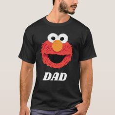 a man wearing a black t - shirt with an image of the sesame character dad