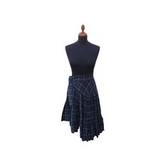 "This wonderful tartan skirt is made from finest wool. The skirt is fastened with six hook and eye fasteners. The predominant colours of the tartan are green and blue, but also include red and yellow. On the waistband you will find a tie on the left side which is 140 cm x 7.5 cm which can be adjusted to taste. The hem and lower skirt are decorated with pleats. Length = 50 cm - 75 cm Waist = 70 cm (due to the waistband tie there is some give in this figure) \"P\" Dry clean only" Fitted Scottish Pleated Skirt, Scottish Style Plaid Lined Skirt, Scottish Style Fitted Pleated Skirt, Yellow Tartan Skirt, Skirt Elegant, Tartan Skirt, Elegant Skirt, Asymmetrical Skirt, Green Skirt