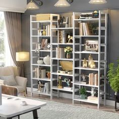 a living room filled with lots of furniture and bookshelves next to a window