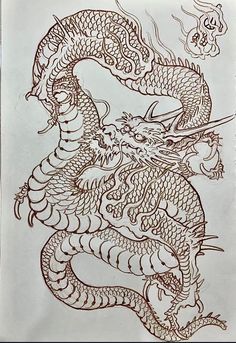 a drawing of a dragon on paper