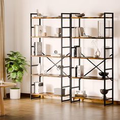 a living room with a wooden floor and shelving unit filled with bookshelves