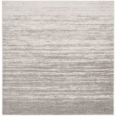 a gray and white rug with stripes on it