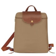 NEW Longchamp 'Le Pliage' Classic Light-weight Nylon Backpack with Leather Trim - 100% Authentic Guaranteed! From a reliable and experienced Top Rated Plus US seller, 16 years on eBay!      Style #: 1699089P49     Color: Desert (also available in Red, Dahlia, Black, Navy, Flower pink, Blush, Pink, Gunmetal, Garnet and Gray)     New with tags attached or sealed in original packaging, MINT condition, never been used!     100% authentic guaranteed! Bought from upscale US department store! Receipt c Dahlia Black, Le Pilage, Red Dahlia, Foldable Backpack, Backpack Material, Gold Bag, Longchamp Le Pliage Backpack, Trending Handbag, Pink Blush